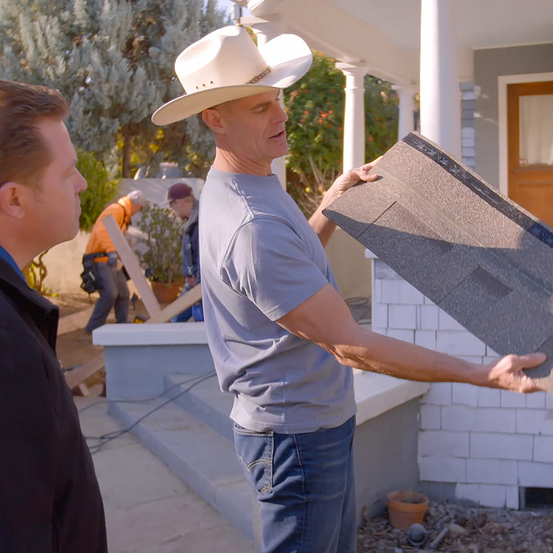 Brett consulting with roofer